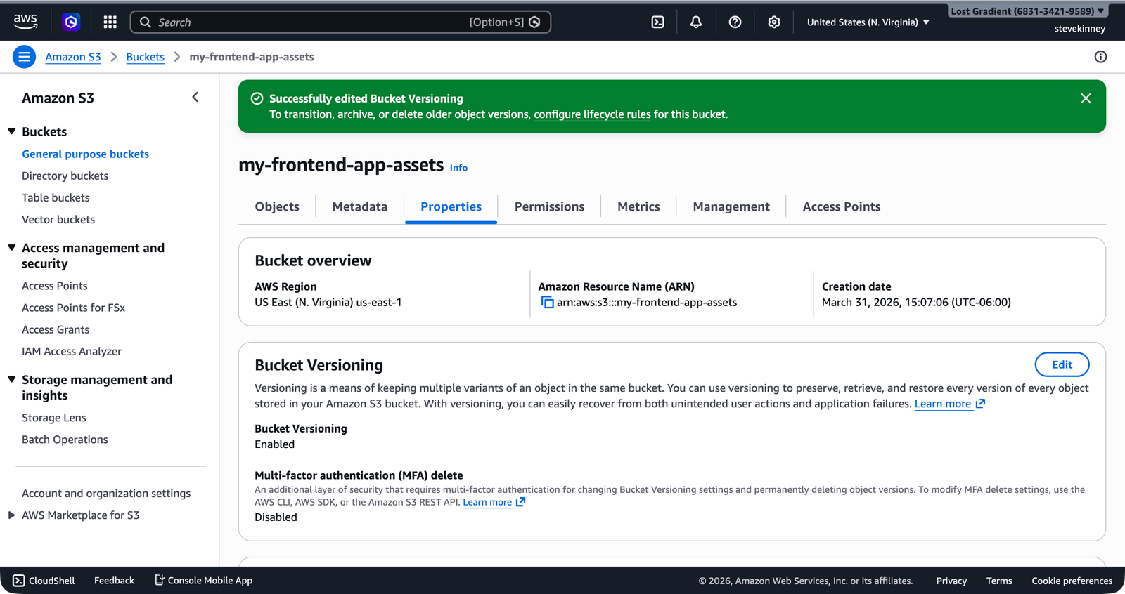 The S3 bucket Properties tab showing Bucket Versioning status set to Enabled with a success banner confirming the change.