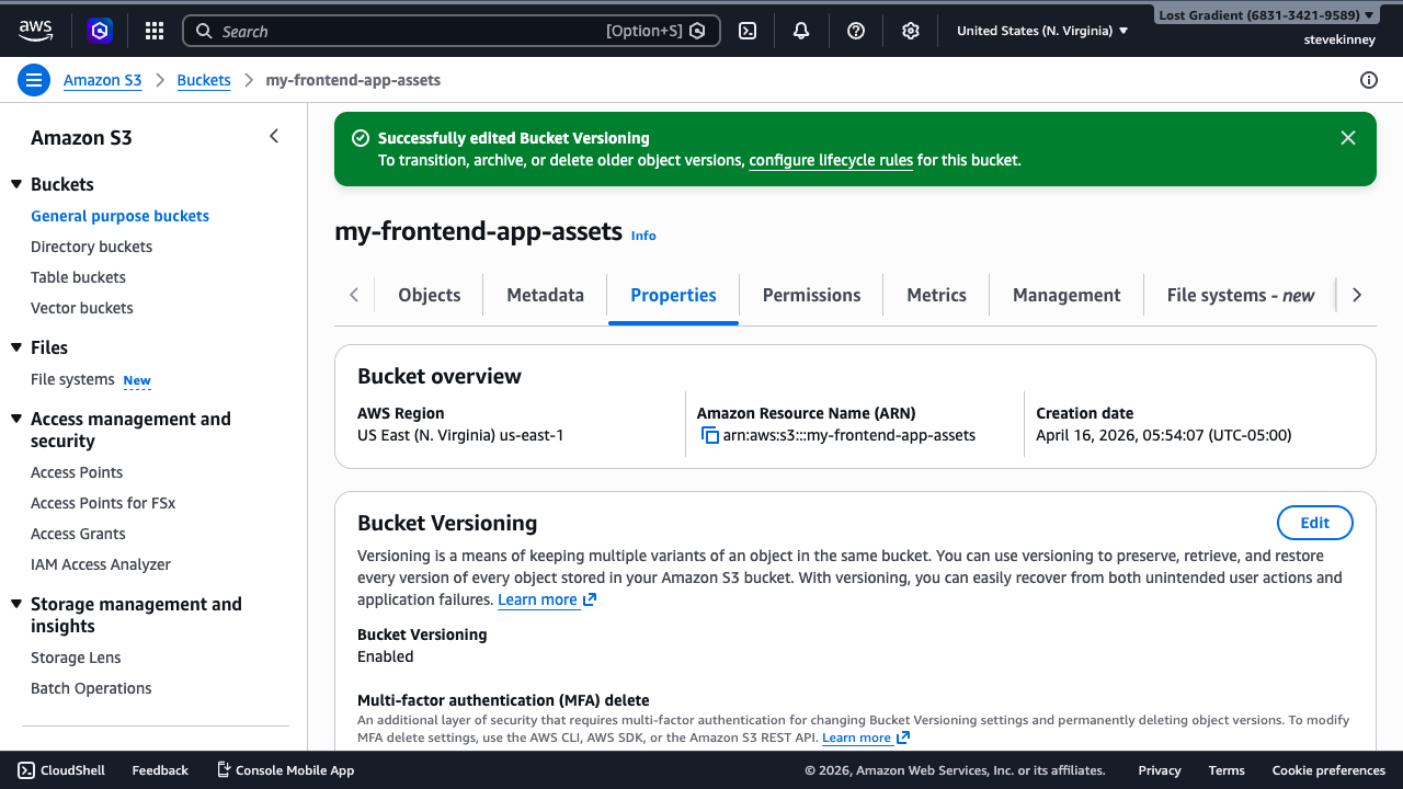 The S3 bucket Properties tab showing Bucket Versioning status set to Enabled with a success banner confirming the change.