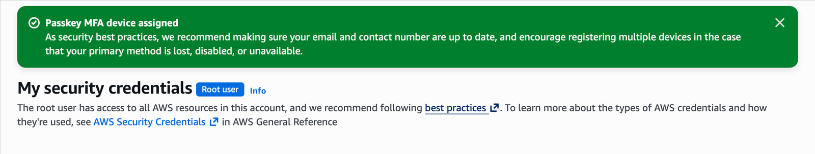 Root security credentials page showing the Passkey MFA device assigned confirmation banner.